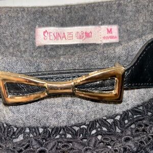 Cute gray mini skirt. Foreign name brand. No stretch to it